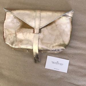 Metallic gold clutch